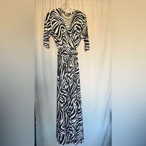 Unbranded black and white striped dress with wrap top size medium.